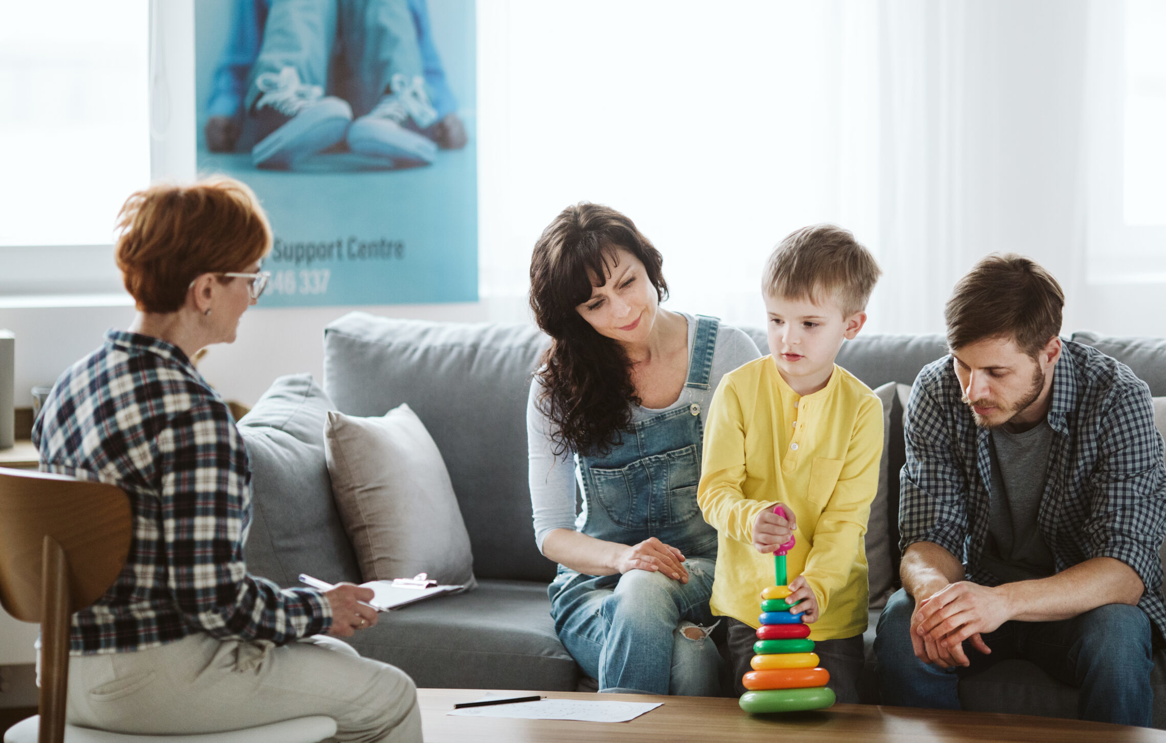 Three adults and a child in support meeting