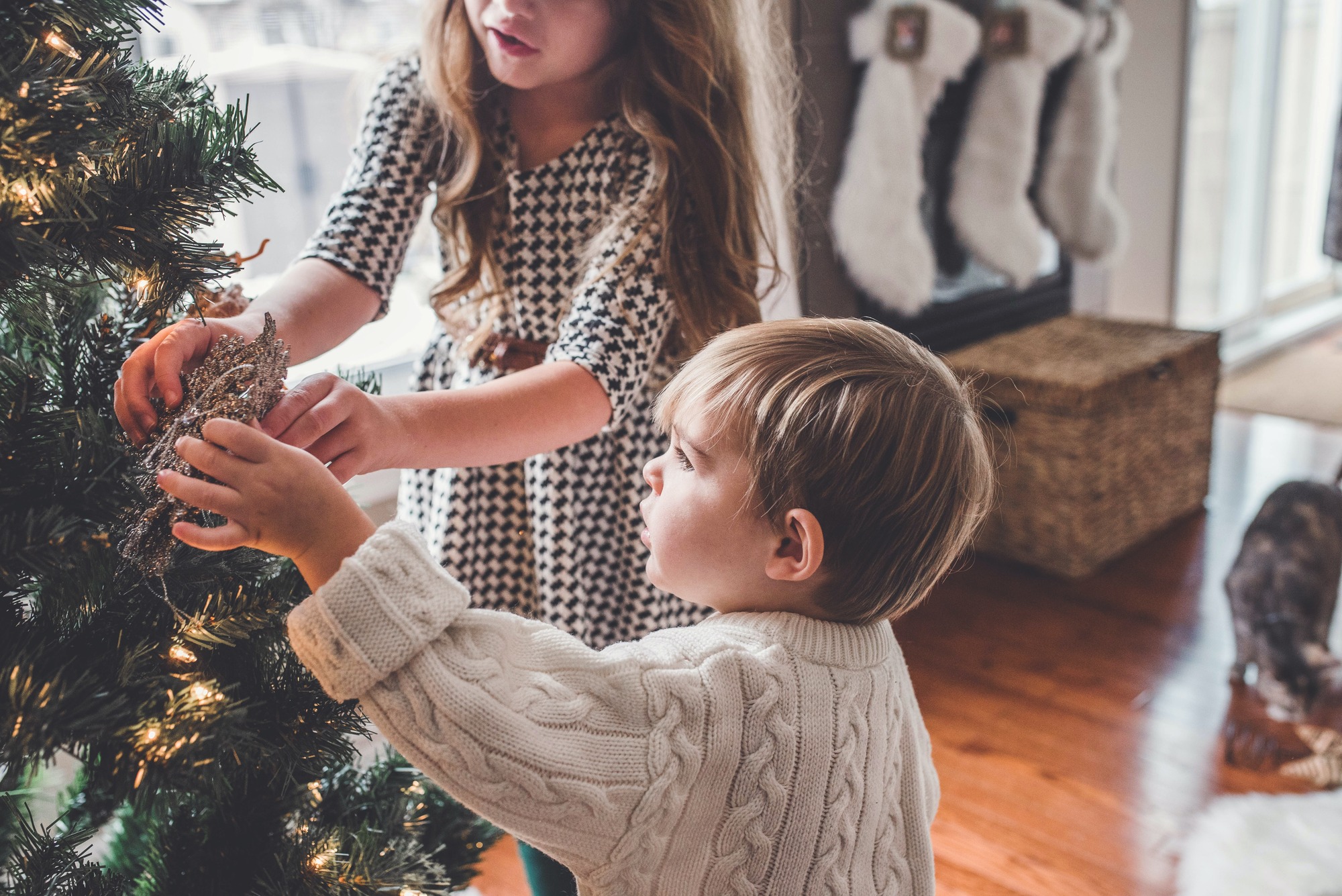 Children decorating a christmas tree