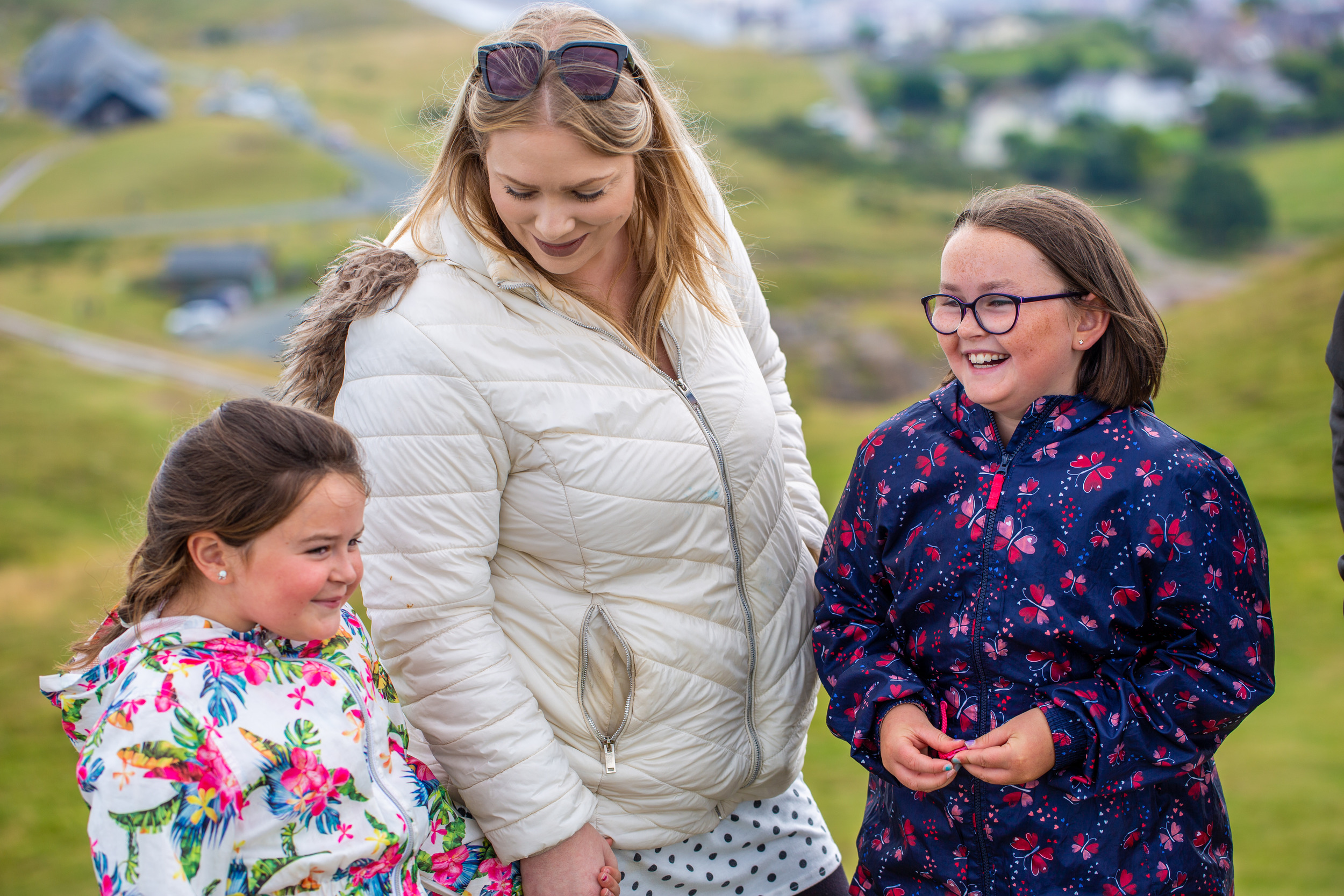 A woman and two girls laughing
